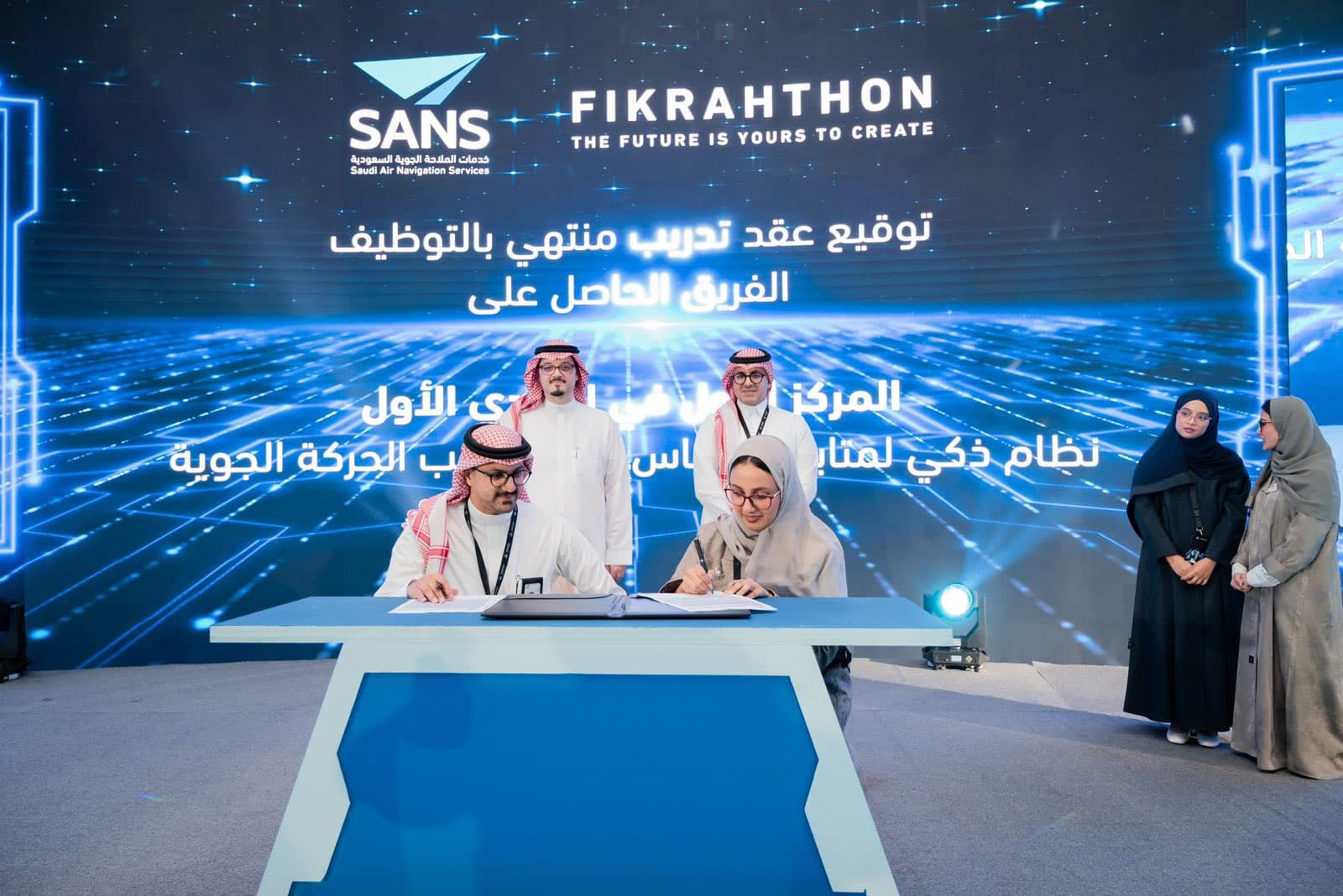 Student team signing employment contracts with SANS at Fikrahthon